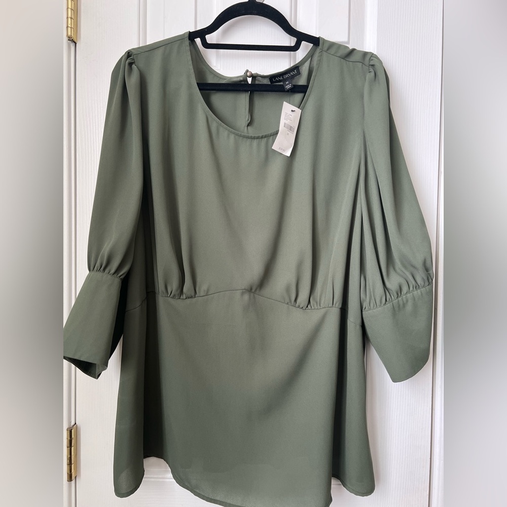 Lane Bryant size 22, olive peplum top, three-quarter sleeve, new with tags.